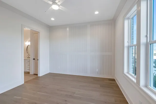 a spacious bathroom with a double vanity sink and a mirror