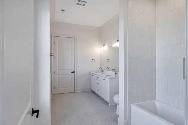 a view of storage and utility room with closet