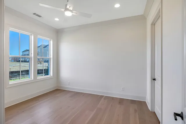 a view of a porch with a door and wooden walls
