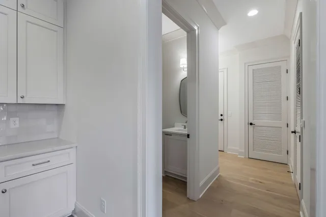 a bathroom with a sink mirror vanity and toilet