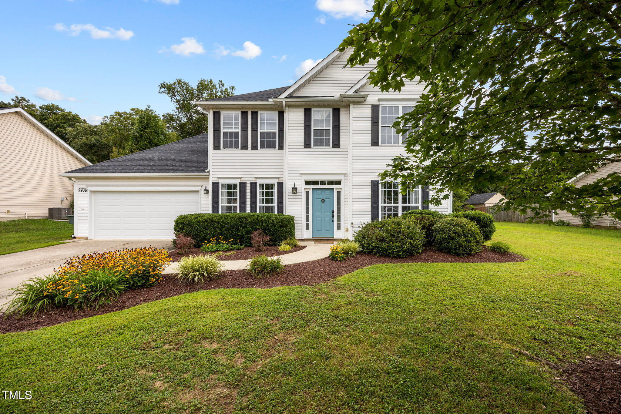 2708 Pepperstone Drive Graham, NC 27253 - Photo 1 of 9 a front view of a house with garden