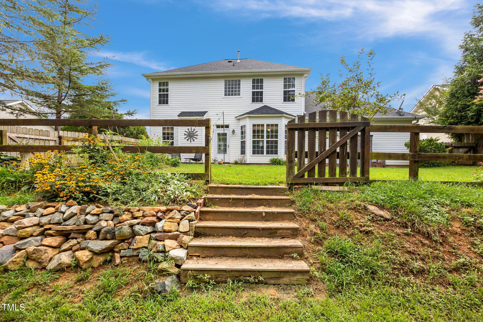 2708 Pepperstone Drive Graham, NC 27253 - Photo 3 of 9 a front view of a house with a yard