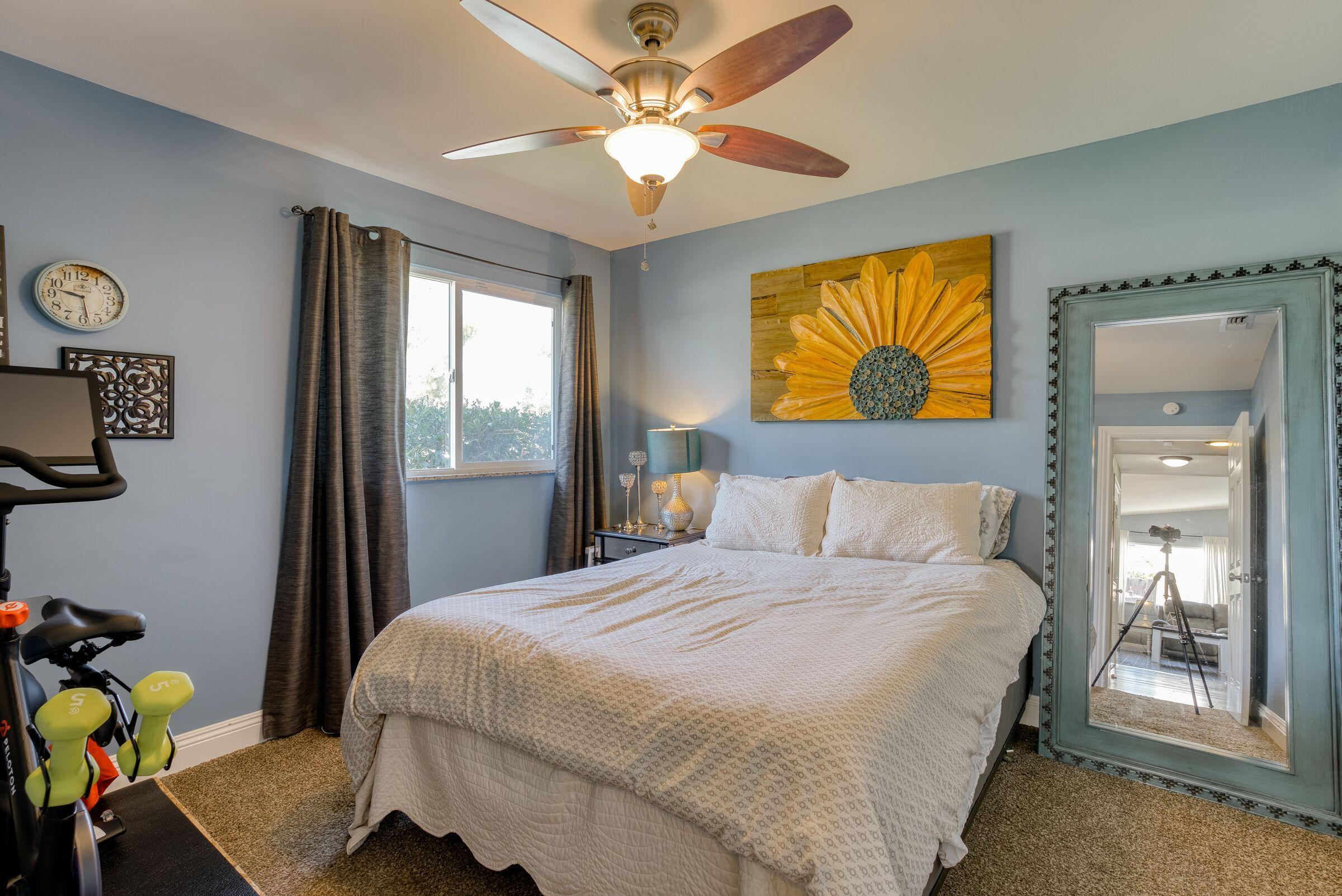 1209 Woodside Meadows Road Redding, CA 96002 - Photo 11 of 22 a bedroom with a bed and window