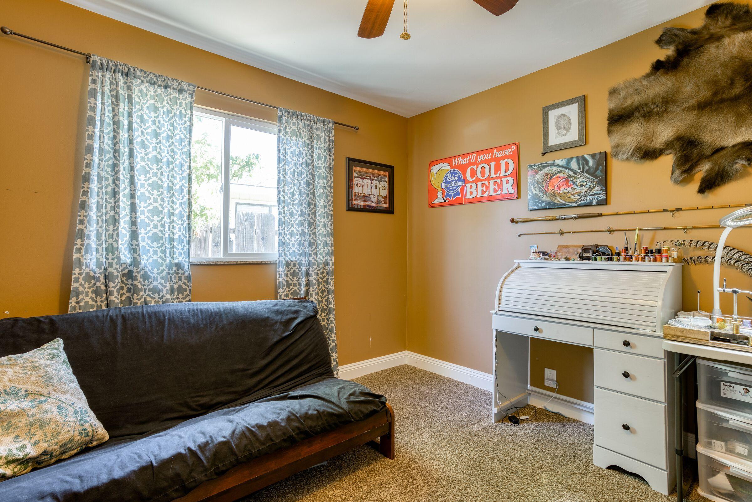 1209 Woodside Meadows Road Redding, CA 96002 - Photo 13 of 22 a bedroom with a bed and wooden floor