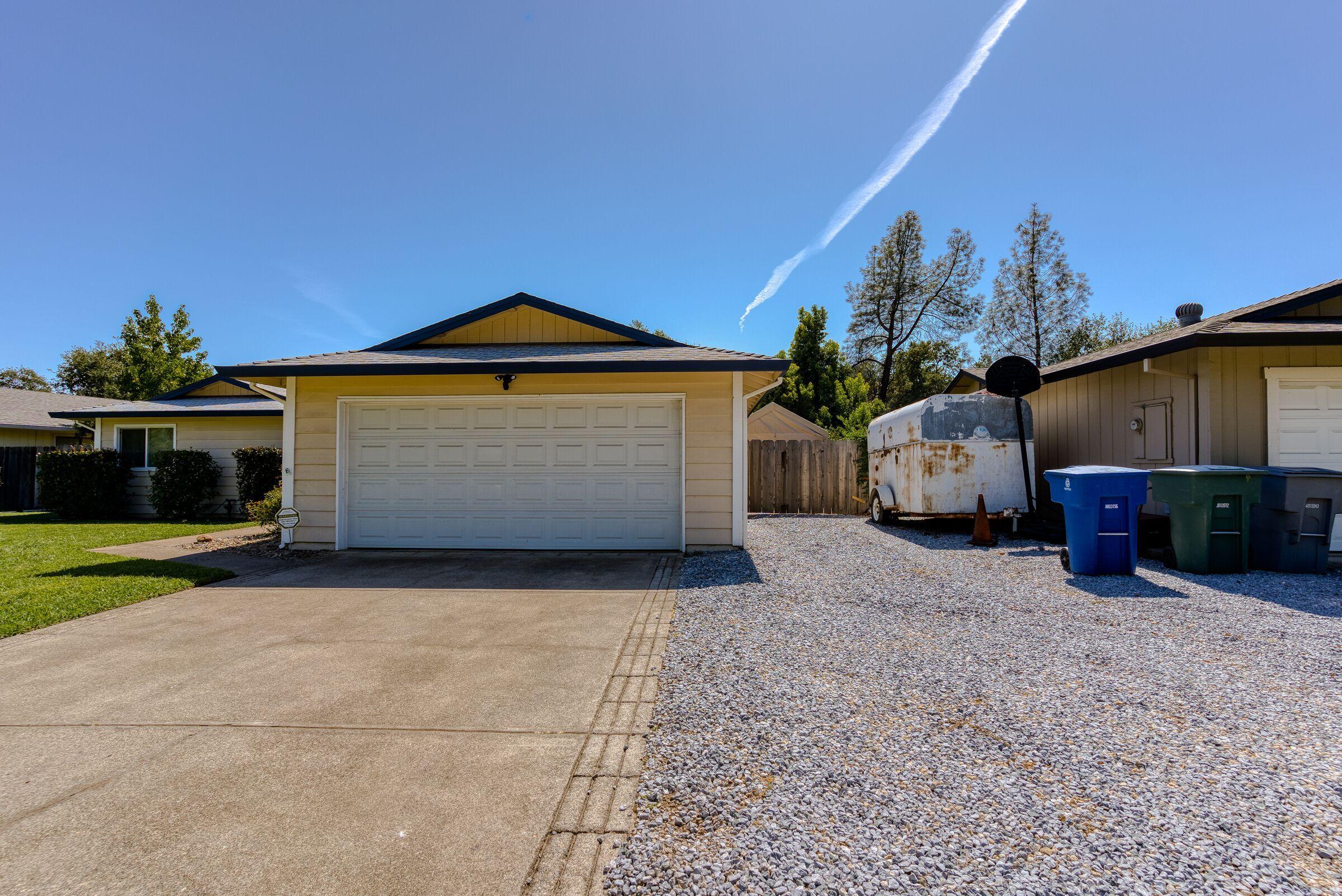1209 Woodside Meadows Road Redding, CA 96002 - Photo 4 of 22 a front view of a house with a yard