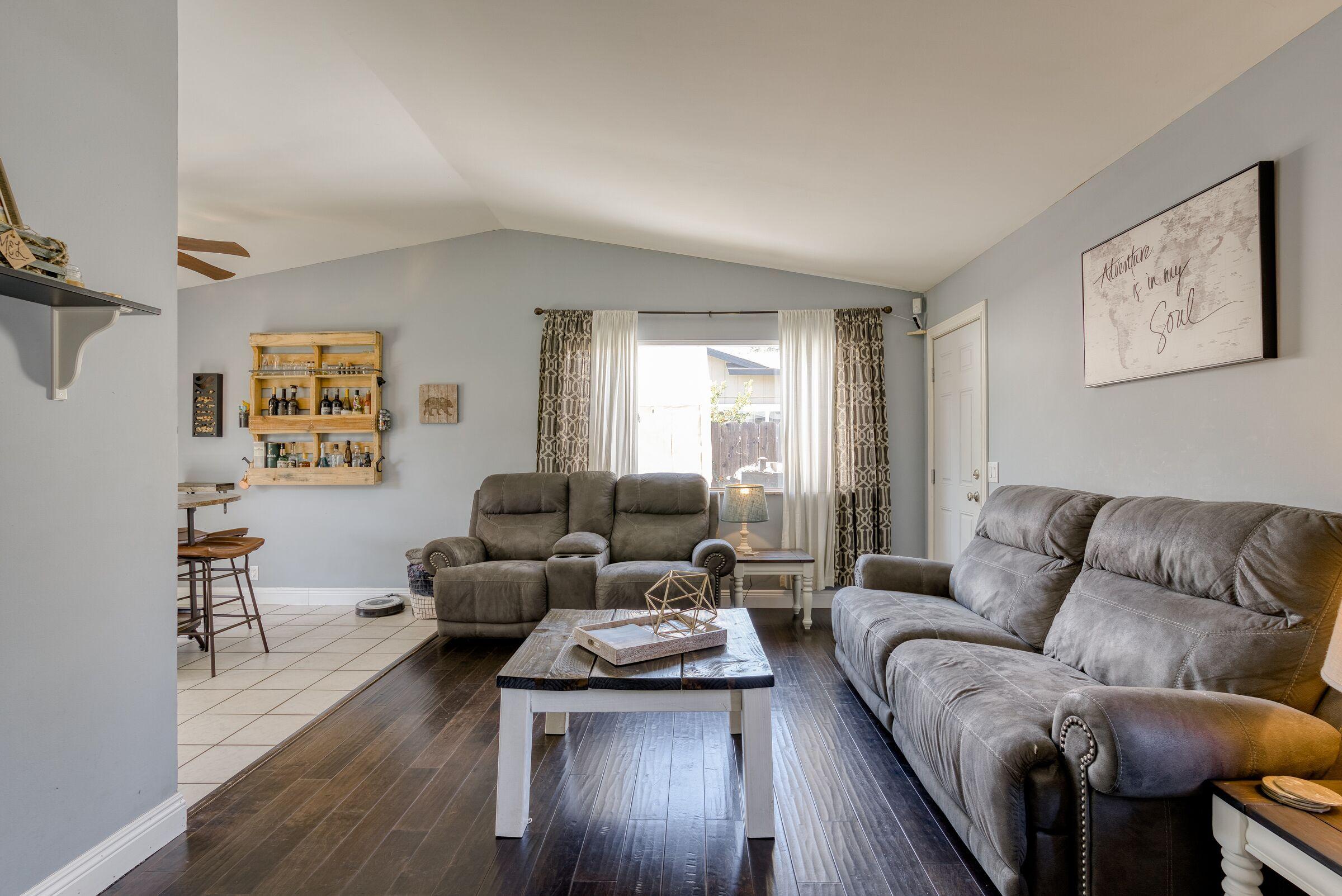 1209 Woodside Meadows Road Redding, CA 96002 - Photo 5 of 22 a living room with furniture and a wooden floor