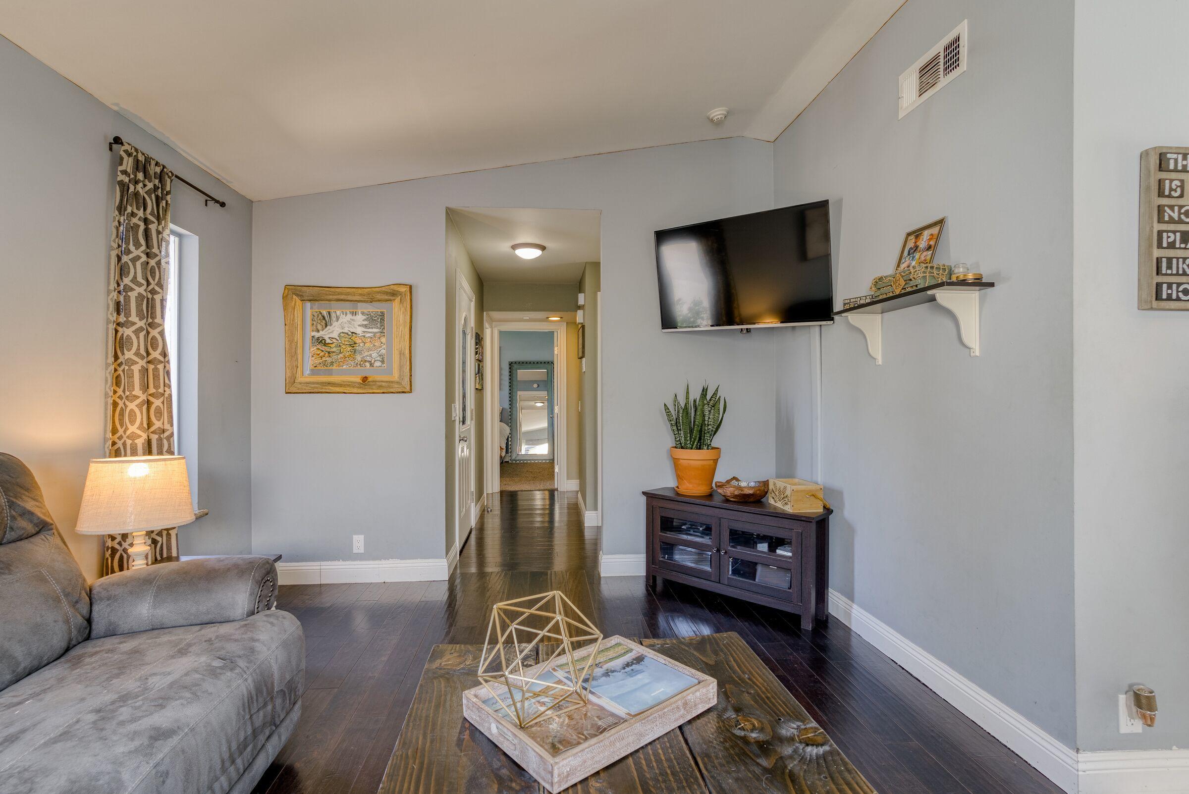 1209 Woodside Meadows Road Redding, CA 96002 - Photo 6 of 22 a living room with furniture and a flat screen tv