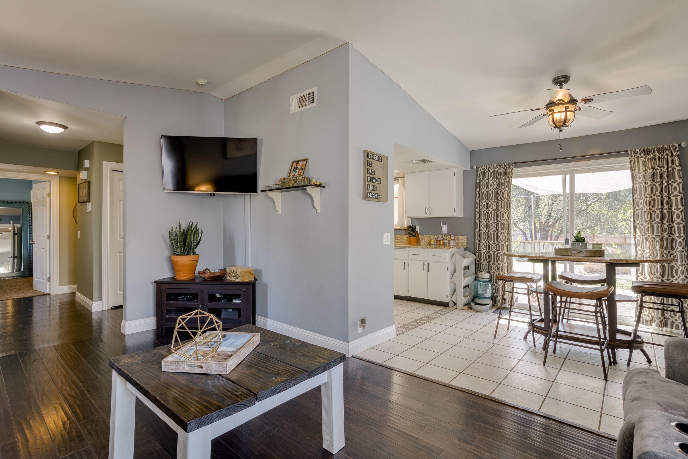 1209 Woodside Meadows Road Redding, CA 96002 - Photo 7 of 22 a living room with furniture and a flat screen tv
