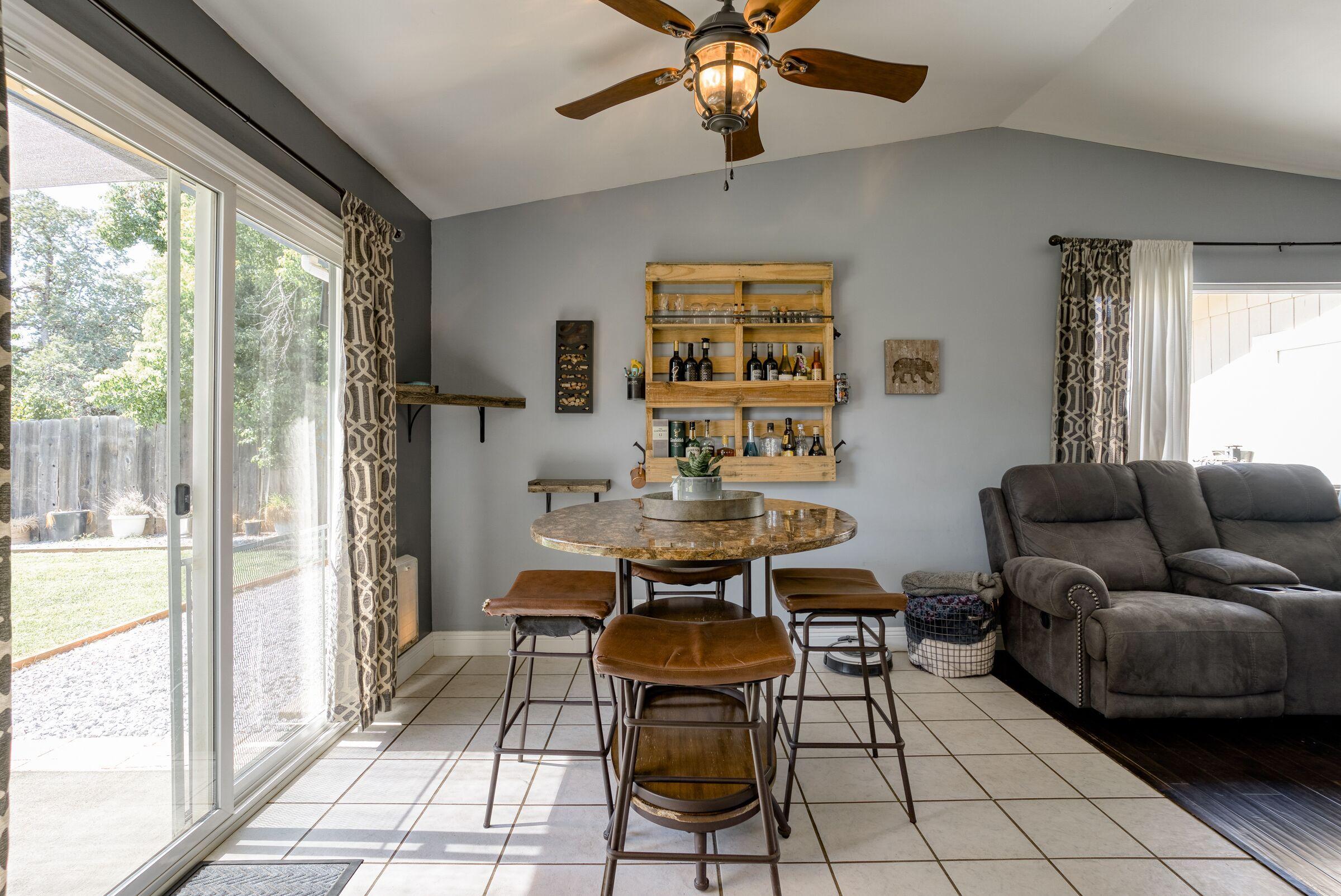 1209 Woodside Meadows Road Redding, CA 96002 - Photo 8 of 22 a workspace with furniture and a window