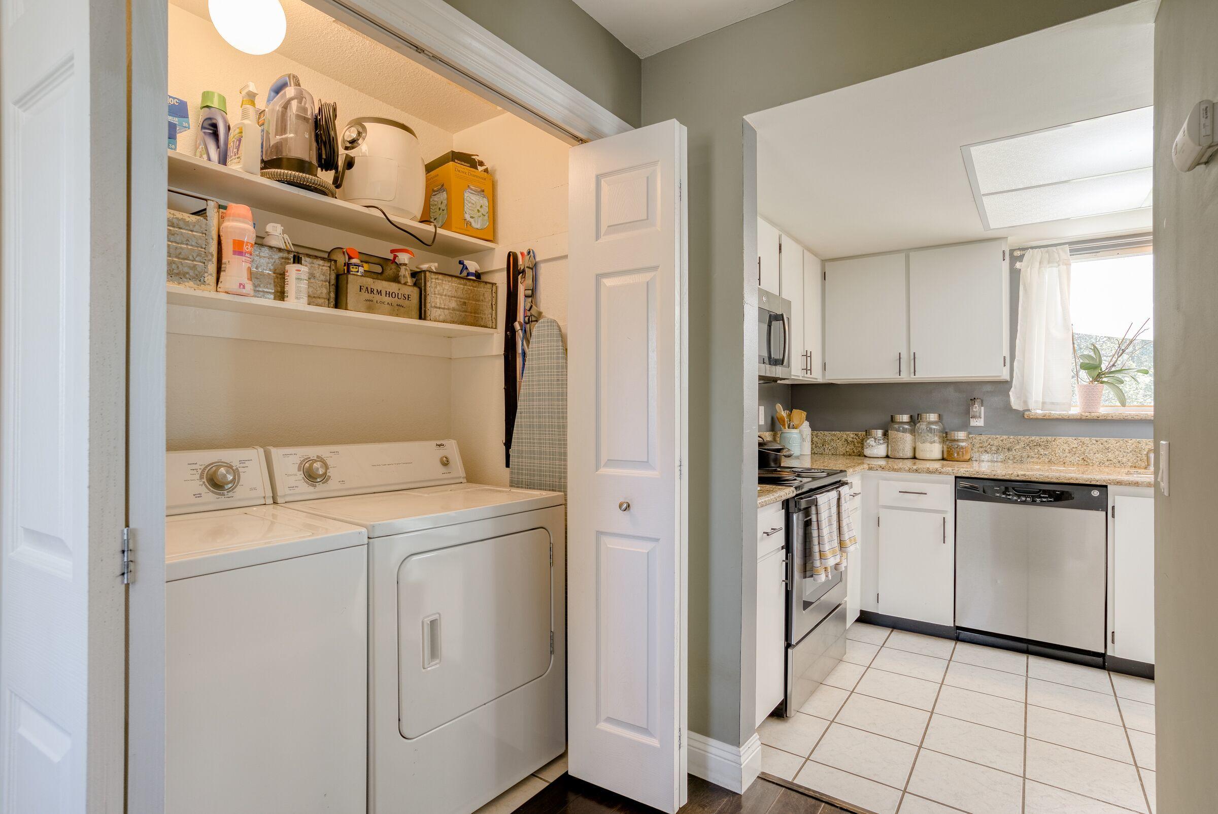 1209 Woodside Meadows Road Redding, CA 96002 - Photo 10 of 22 a kitchen with a stove top oven and cabinets