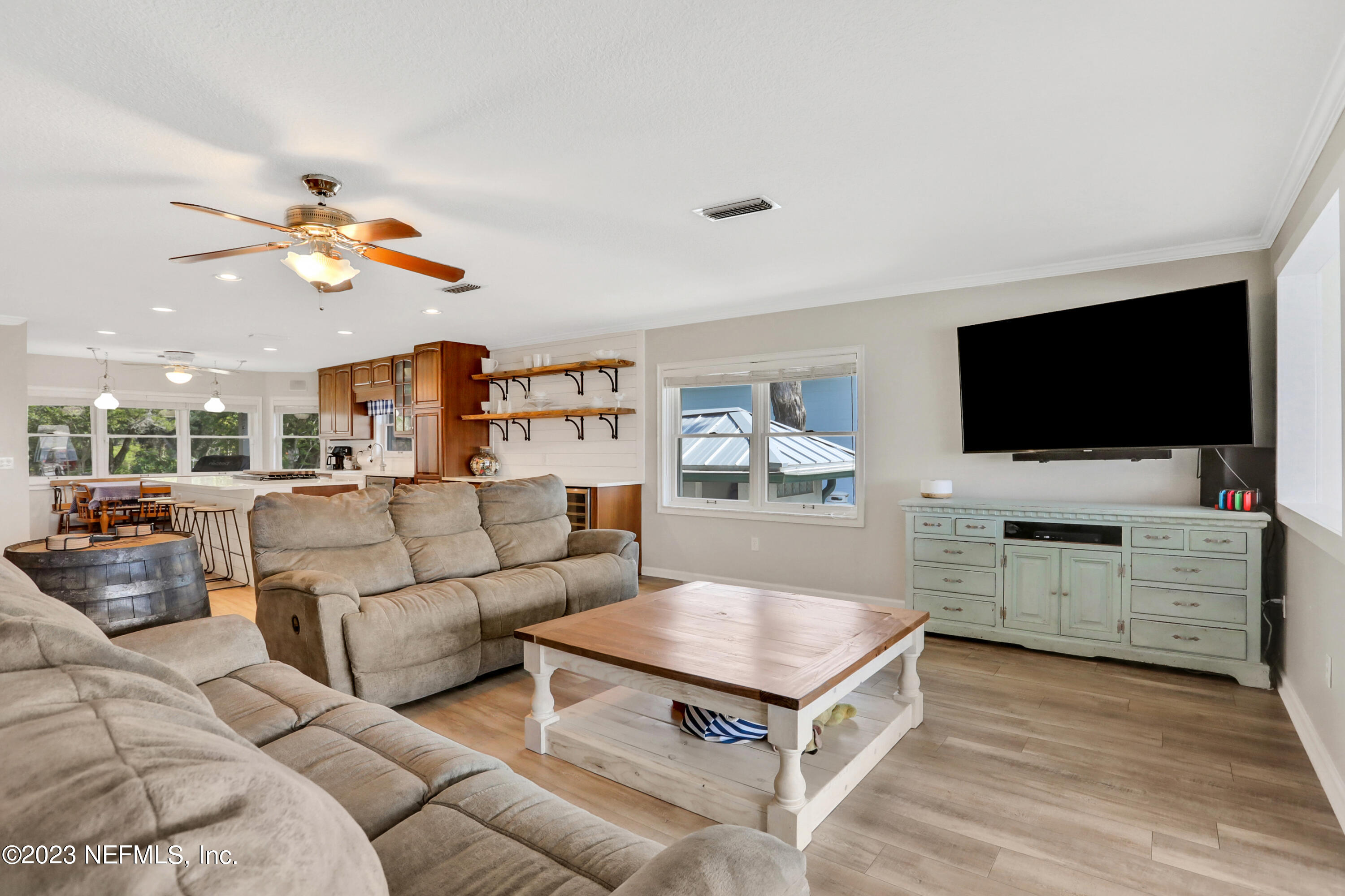 10100 Heckscher Drive Jacksonville, FL 32226 - Photo 15 of 90 a living room with furniture and a flat screen tv