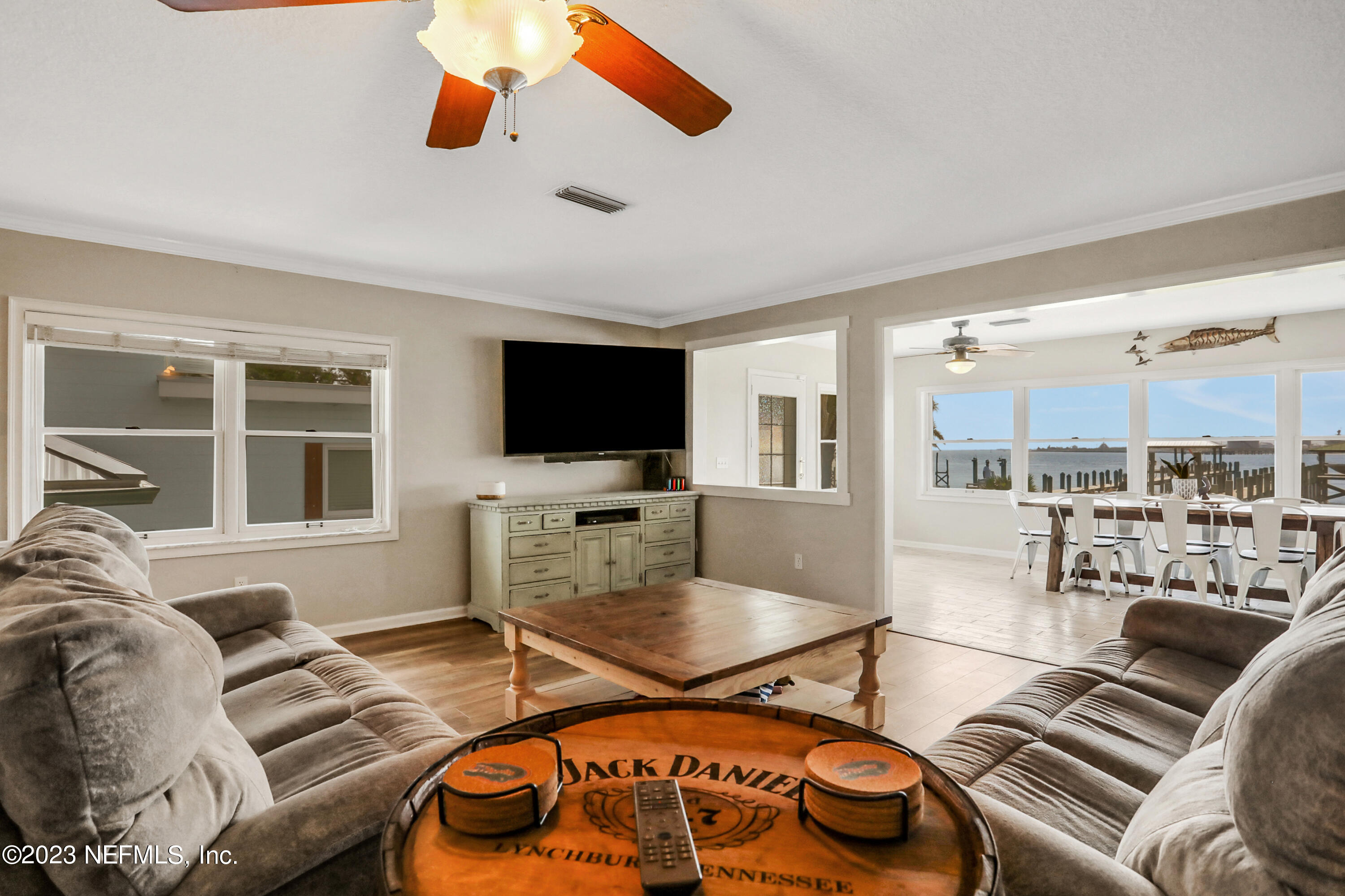 10100 Heckscher Drive Jacksonville, FL 32226 - Photo 17 of 90 a living room with furniture and a flat screen tv
