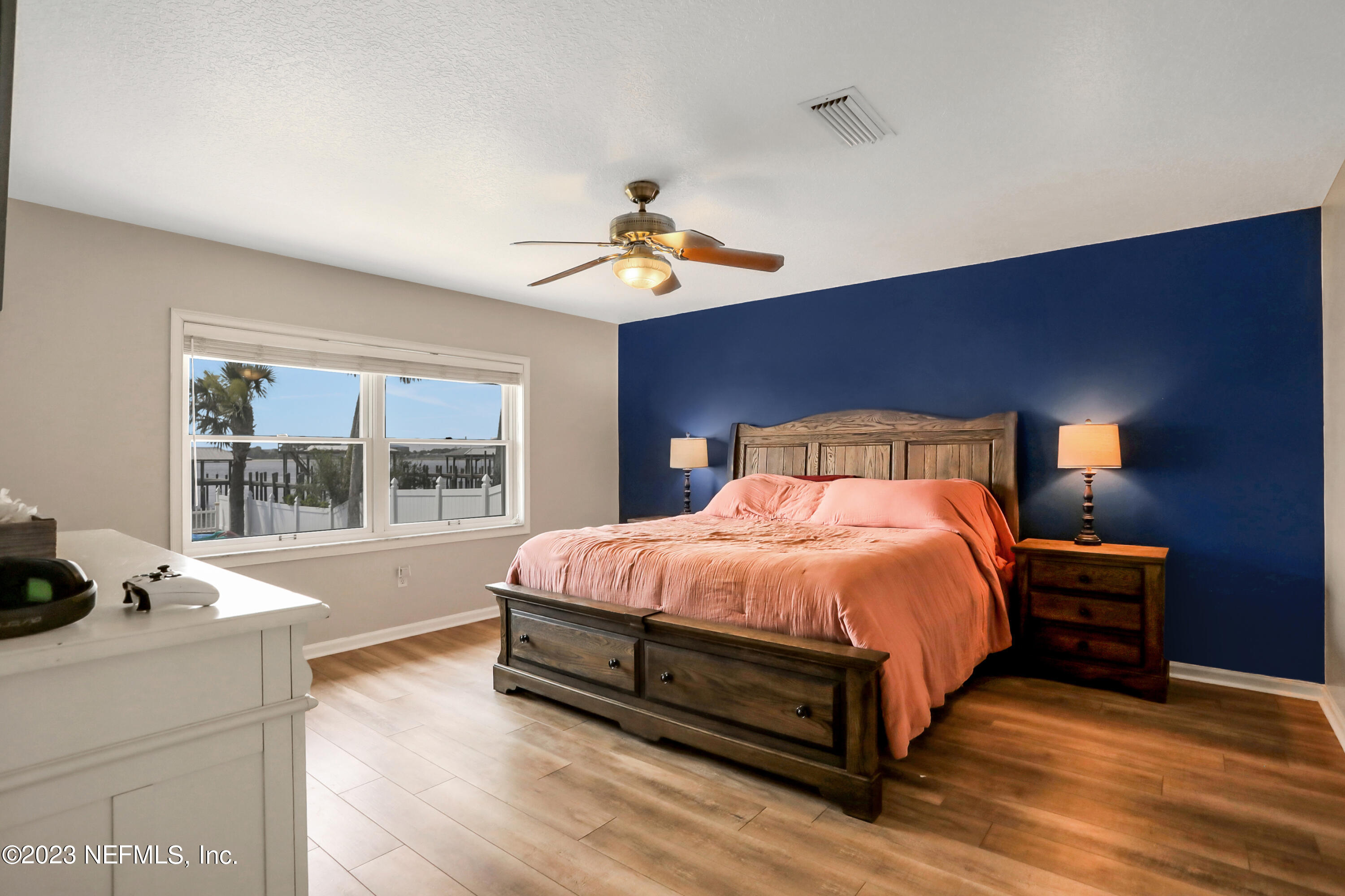 10100 Heckscher Drive Jacksonville, FL 32226 - Photo 22 of 90 a bedroom with a bed and a large window