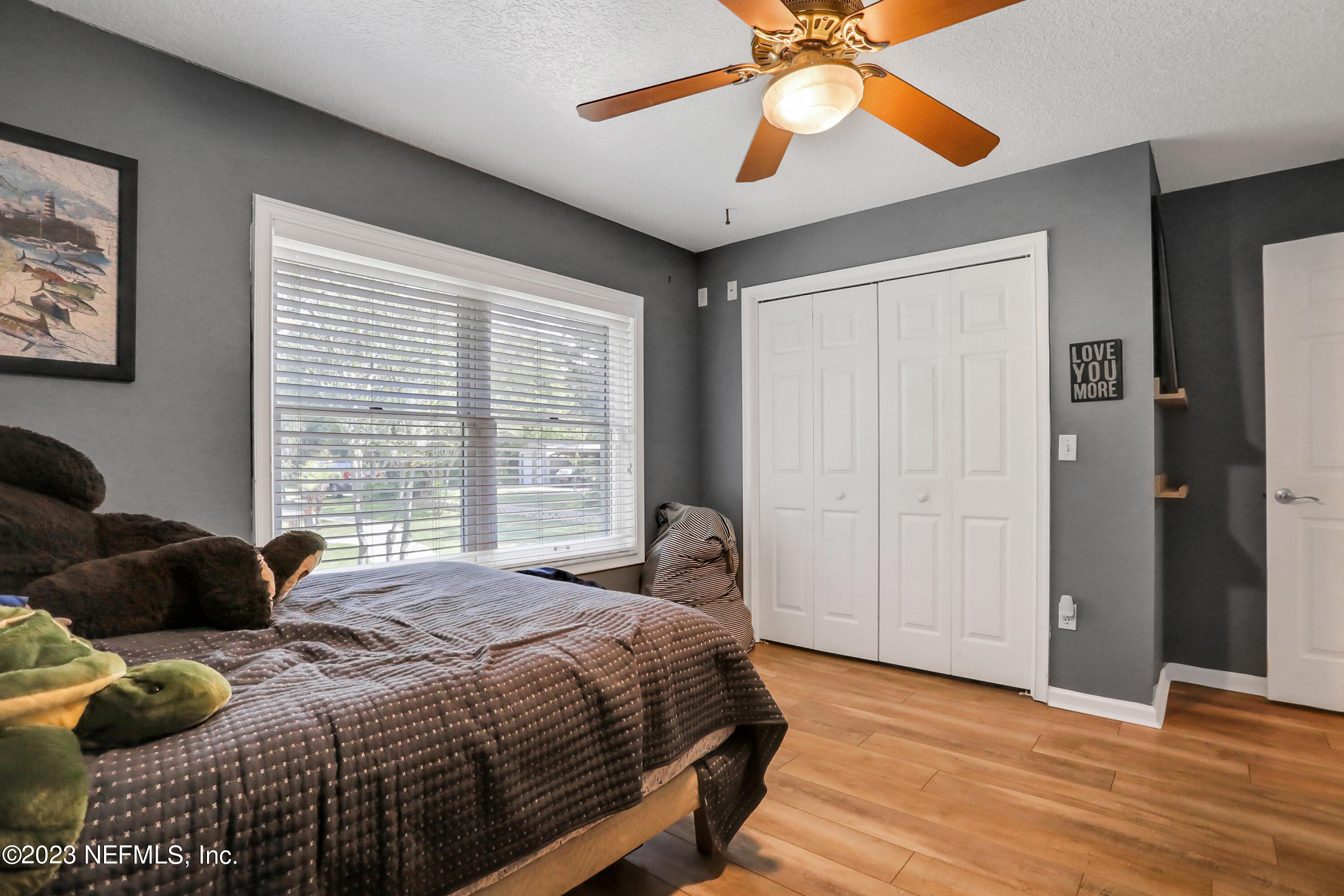 10100 Heckscher Drive Jacksonville, FL 32226 - Photo 26 of 90 a bedroom with a bed and a window