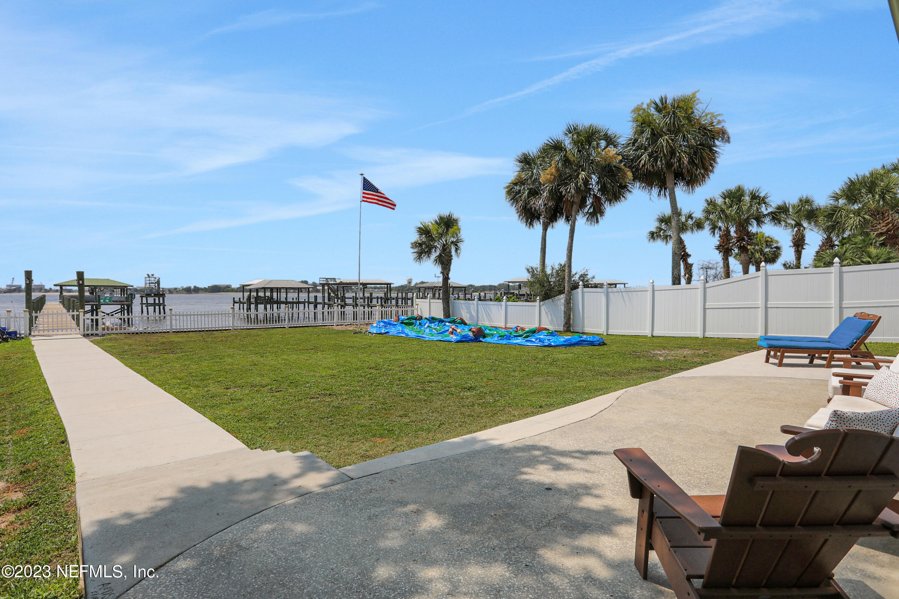 10100 Heckscher Drive Jacksonville, FL 32226 - Photo 3 of 90 a view of a swimming pool and lounge chairs