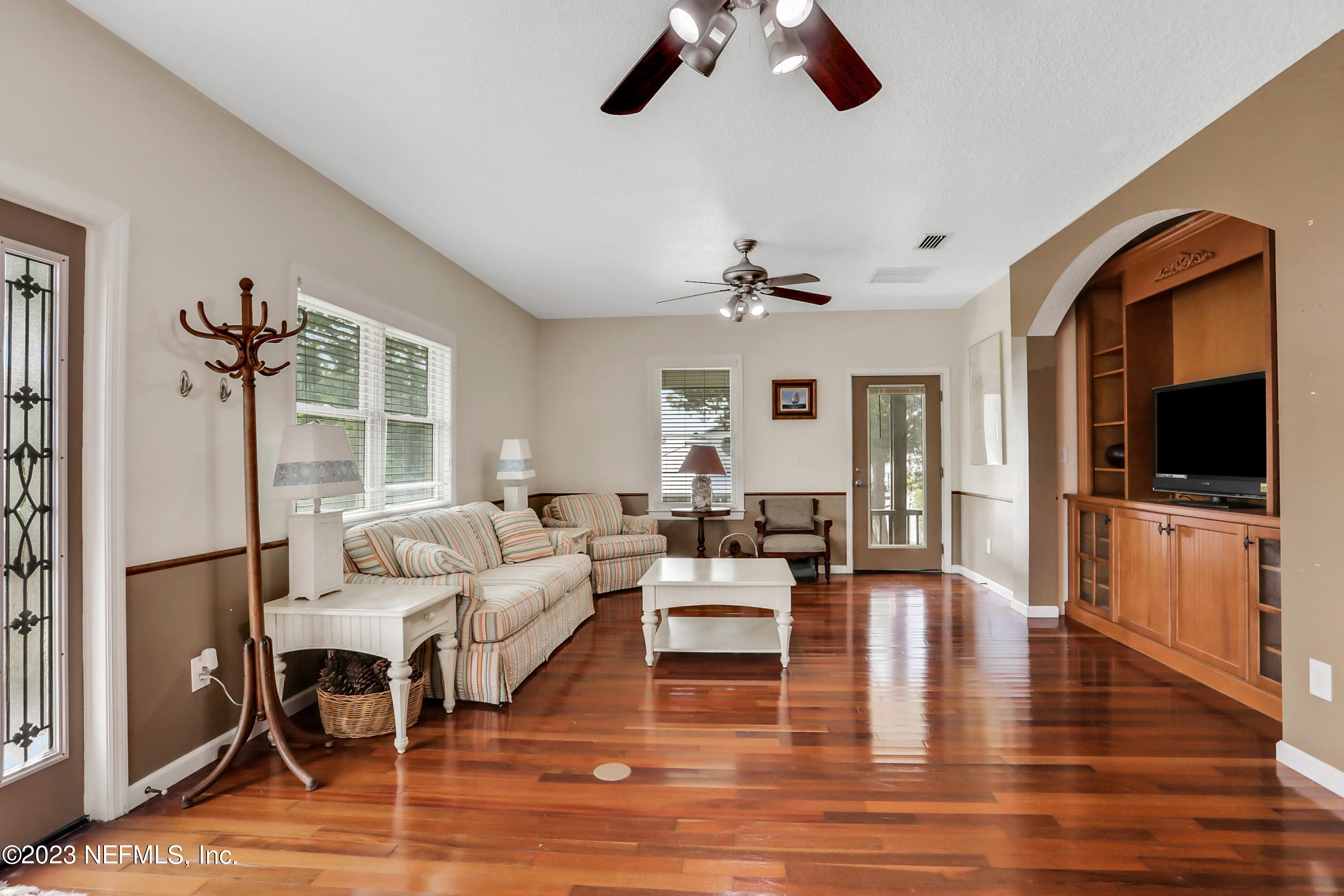 10100 Heckscher Drive Jacksonville, FL 32226 - Photo 38 of 90 a living room with furniture and a flat screen tv