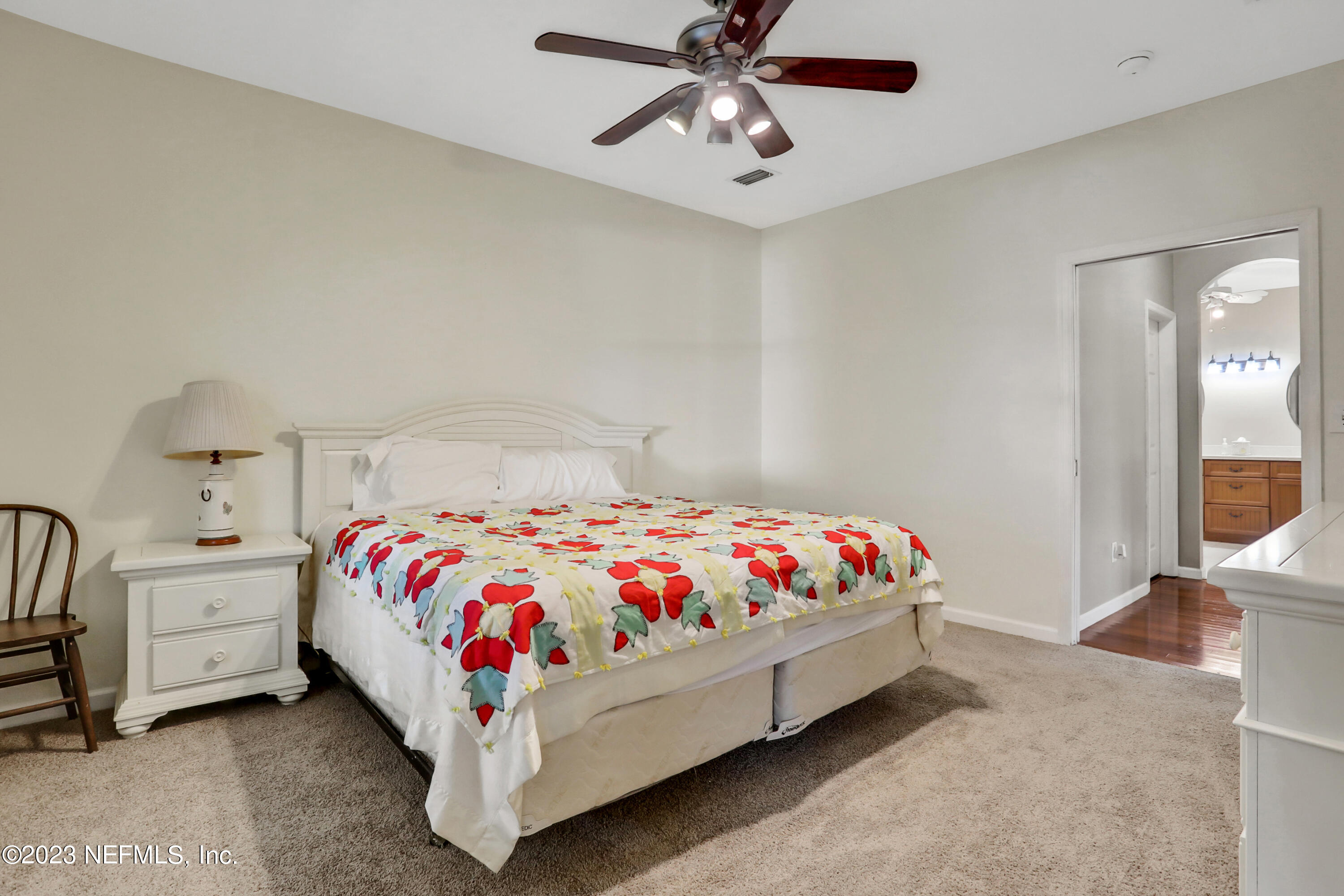 10100 Heckscher Drive Jacksonville, FL 32226 - Photo 41 of 90 a bed room with a bed and a chandelier