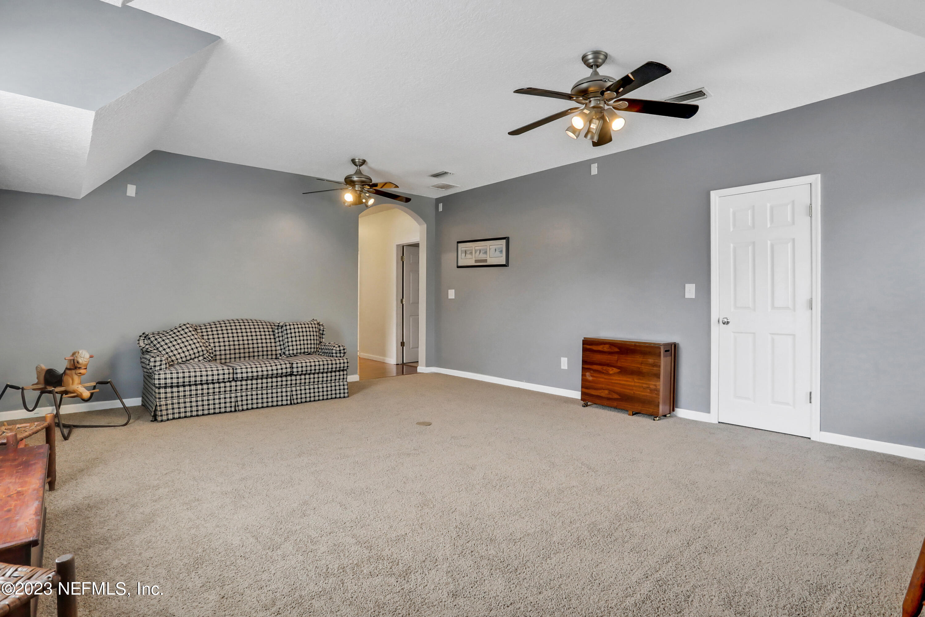 10100 Heckscher Drive Jacksonville, FL 32226 - Photo 51 of 90 a living room with furniture and a ceiling fan
