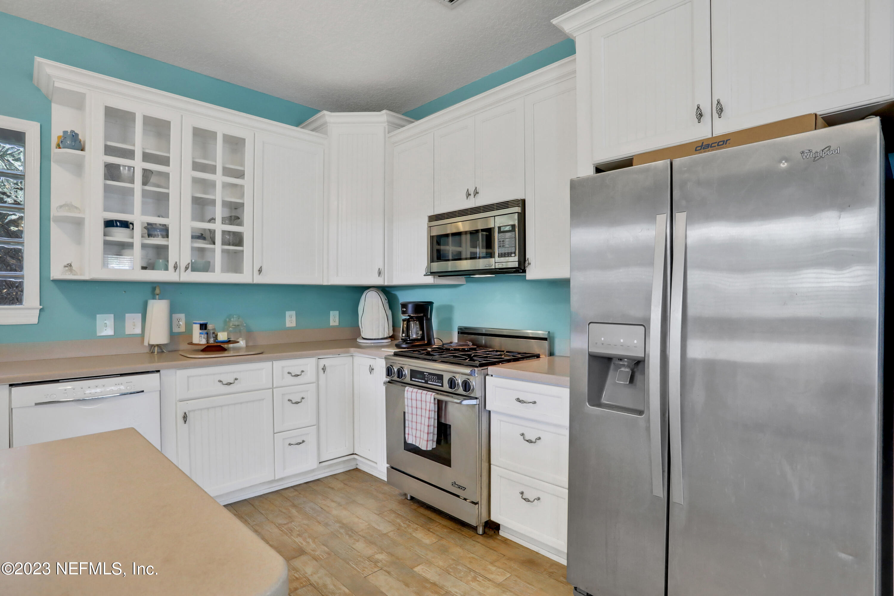 10100 Heckscher Drive Jacksonville, FL 32226 - Photo 60 of 90 a kitchen with cabinets stainless steel appliances and a counter space