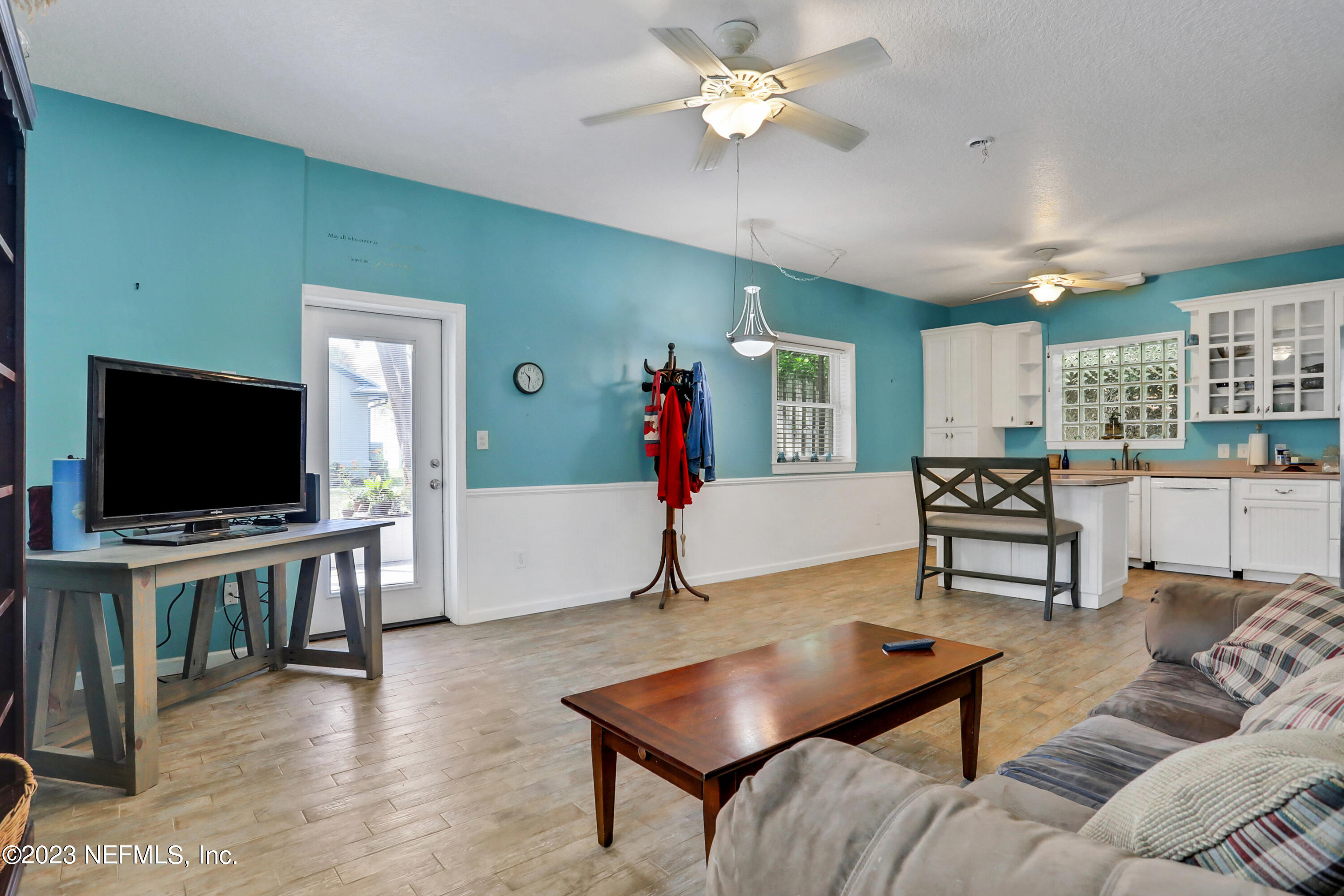 10100 Heckscher Drive Jacksonville, FL 32226 - Photo 61 of 90 a living room with furniture and a flat screen tv