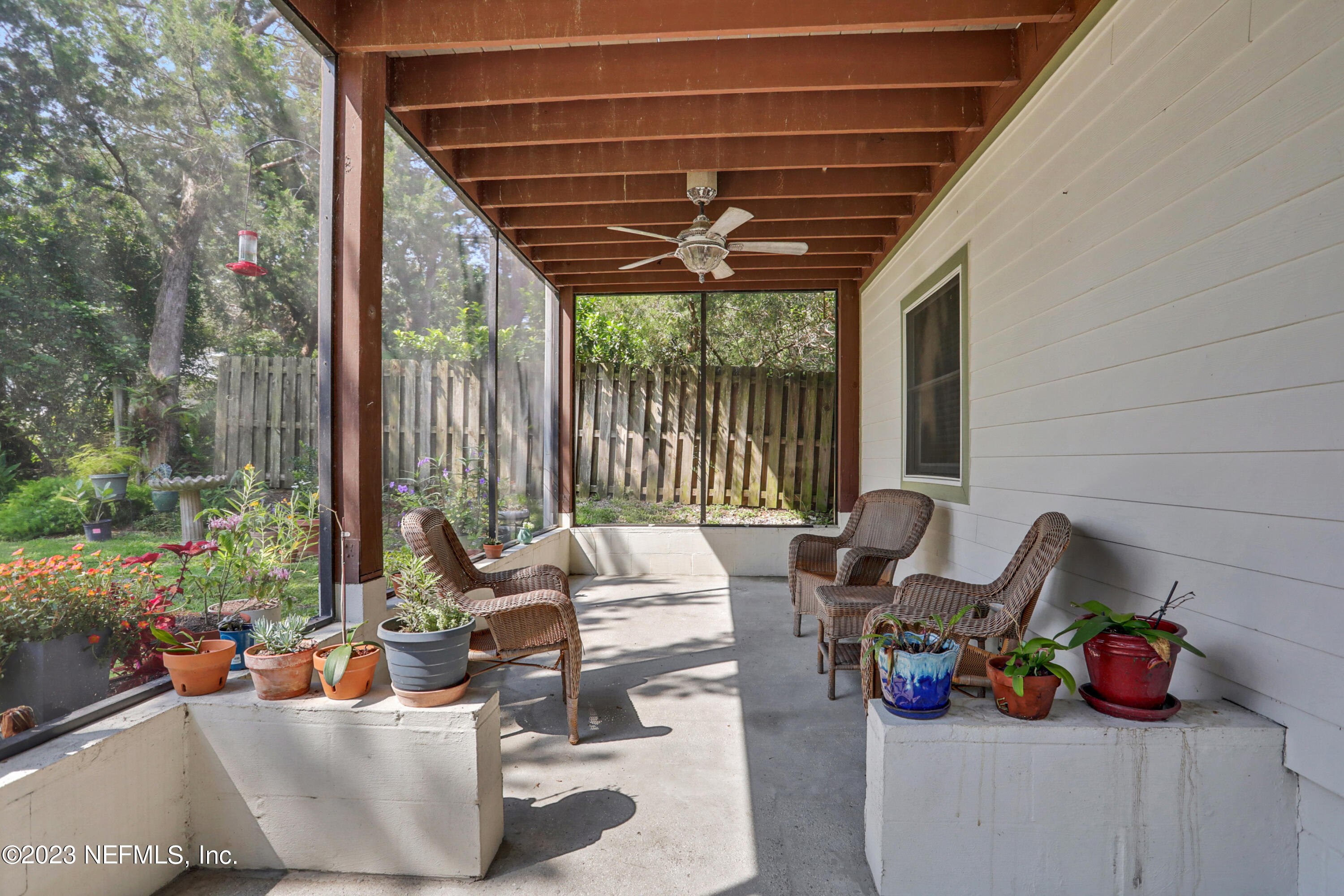 10100 Heckscher Drive Jacksonville, FL 32226 - Photo 70 of 90 a living room with patio furniture and a potted plants