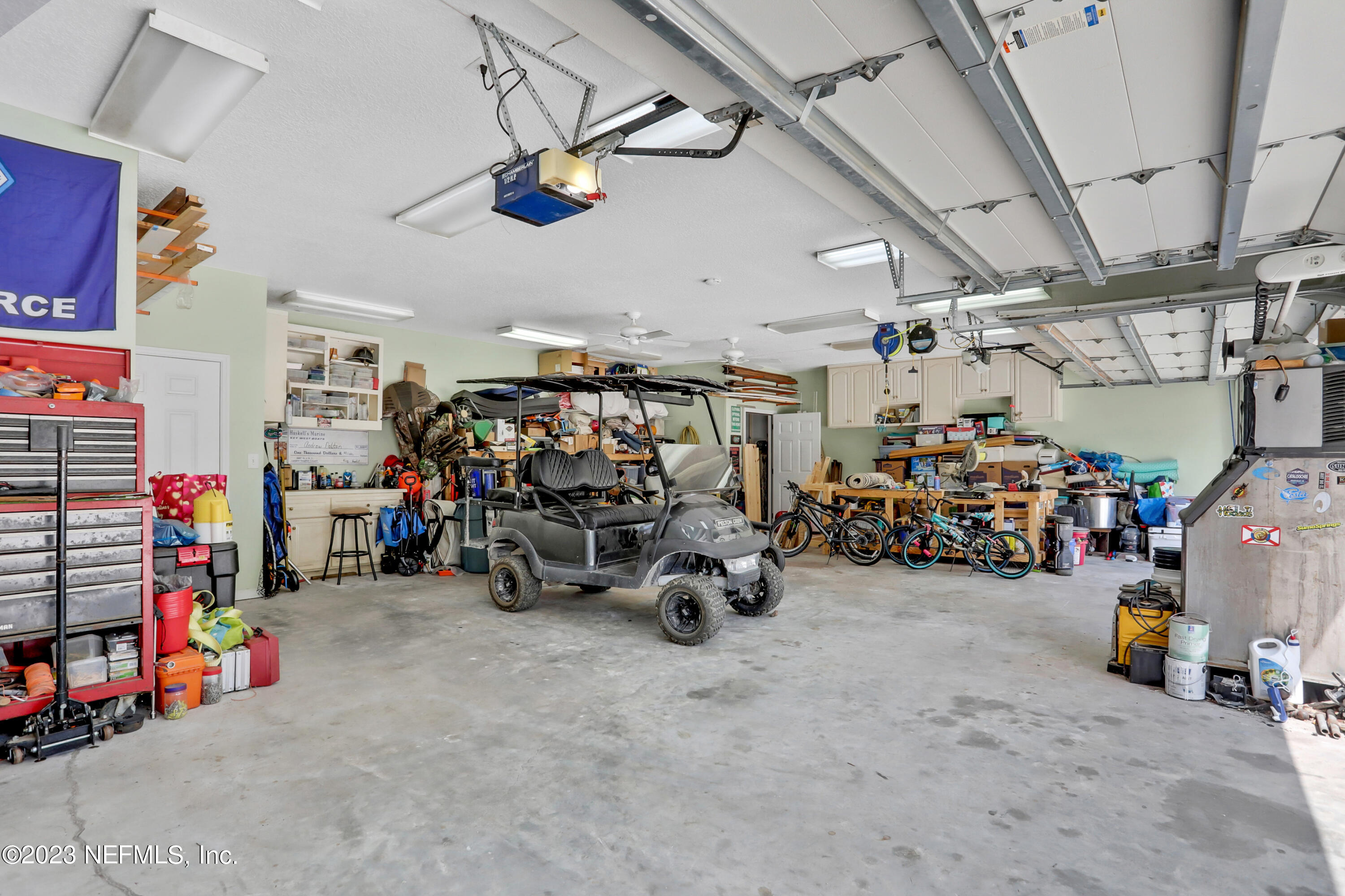 10100 Heckscher Drive Jacksonville, FL 32226 - Photo 73 of 90 a view of a storage room with a lot of stuff and a garage