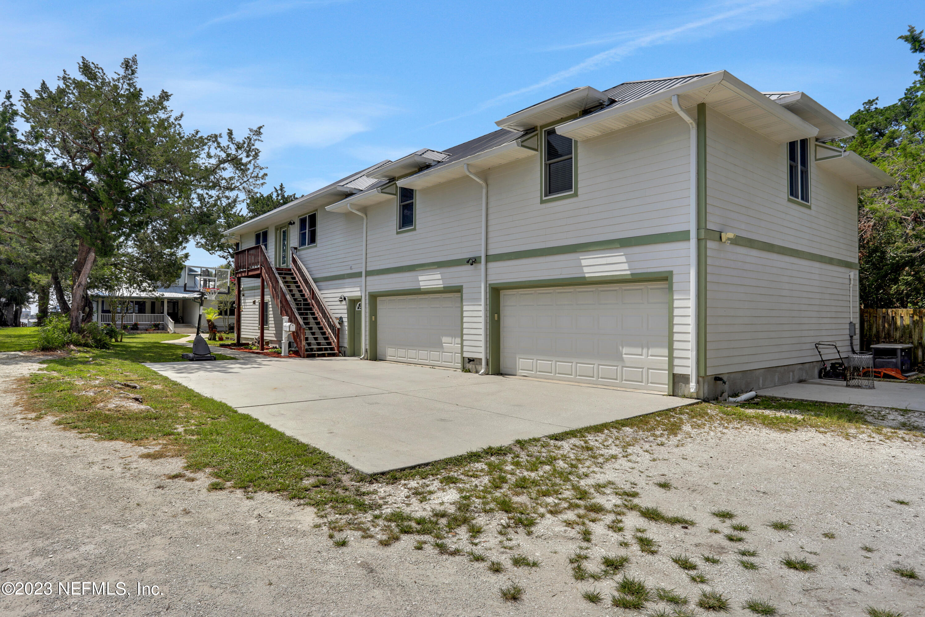 10100 Heckscher Drive Jacksonville, FL 32226 - Photo 75 of 90 a view of a house with a yard and large tree