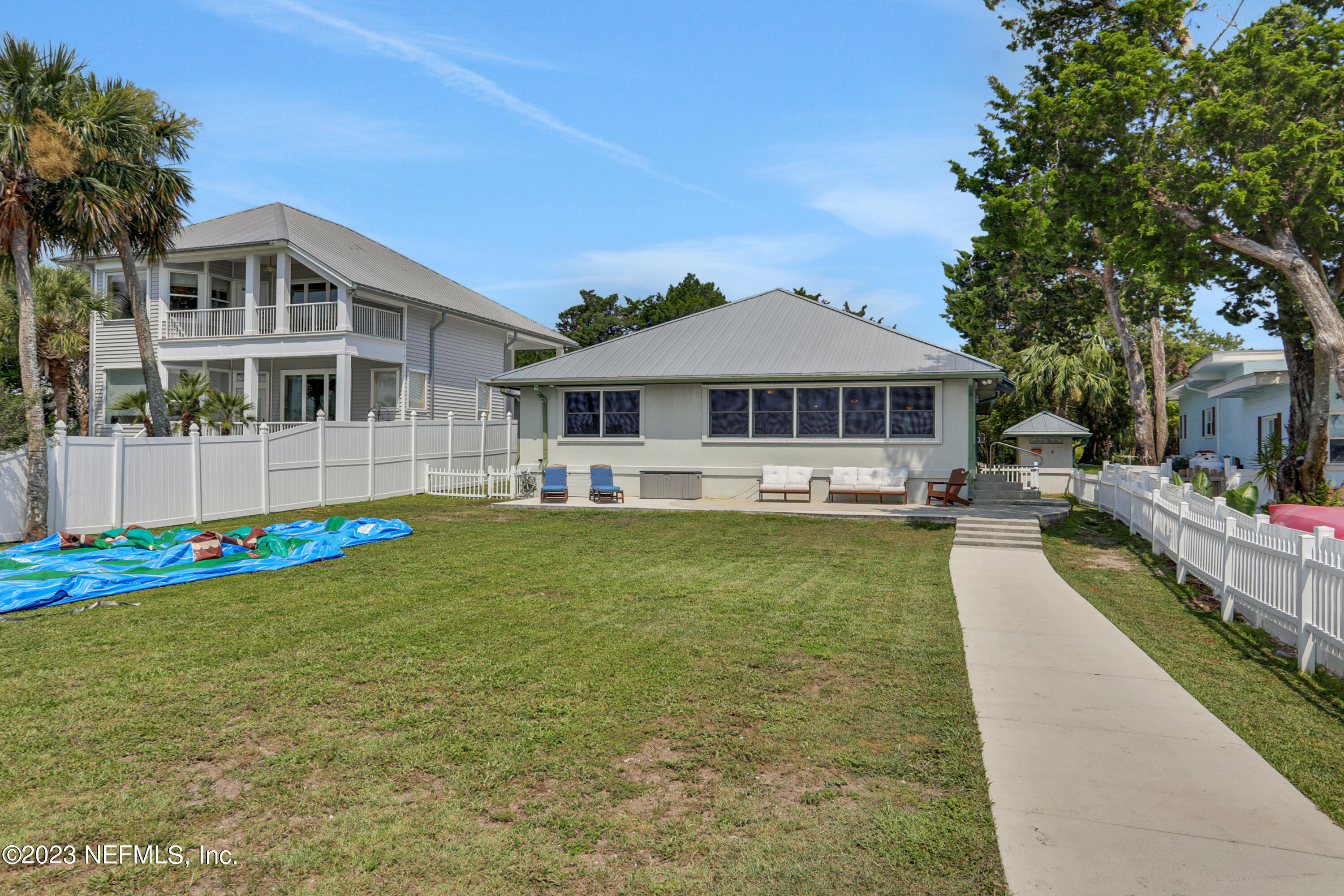 10100 Heckscher Drive Jacksonville, FL 32226 - Photo 77 of 90 a front view of a house with swimming pool having outdoor seating