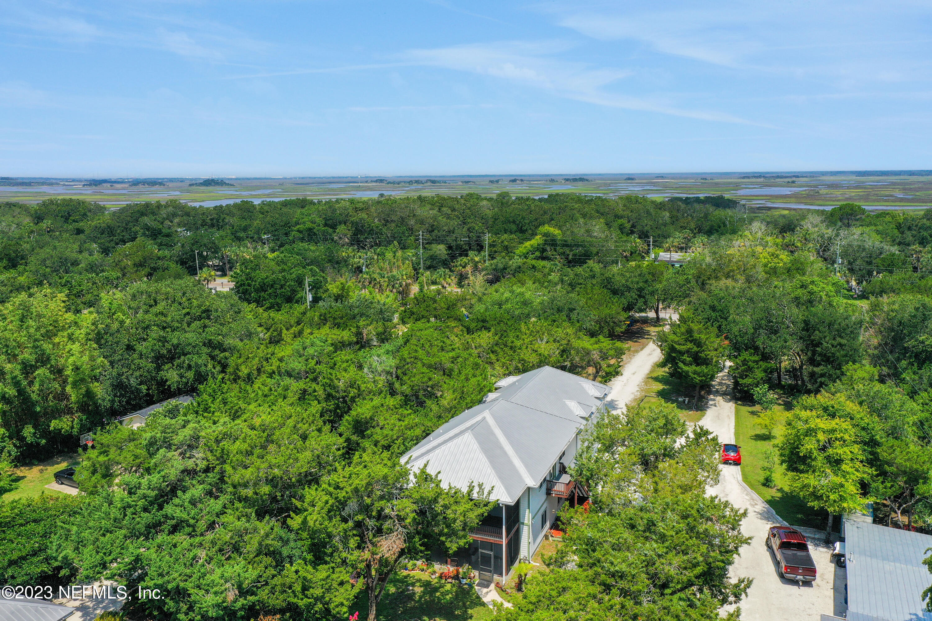 10100 Heckscher Drive Jacksonville, FL 32226 - Photo 87 of 90 an aerial view of a house with a yard and lake view