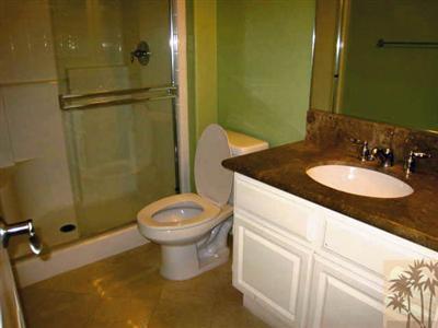 81908 Villa Reale Drive Indio, CA 92203 - Photo 13 of 25 a bathroom with a granite countertop sink toilet and shower