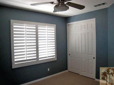 81908 Villa Reale Drive Indio, CA 92203 - Photo 19 of 25 a view of a livingroom with a ceiling fan and a window