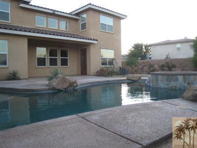 81908 Villa Reale Drive Indio, CA 92203 - Photo 24 of 25 a backyard of a house with lake view
