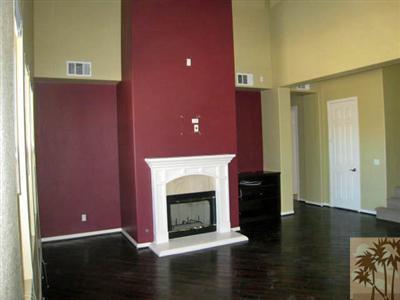 81908 Villa Reale Drive Indio, CA 92203 - Photo 9 of 25 a living room with furniture and a fireplace