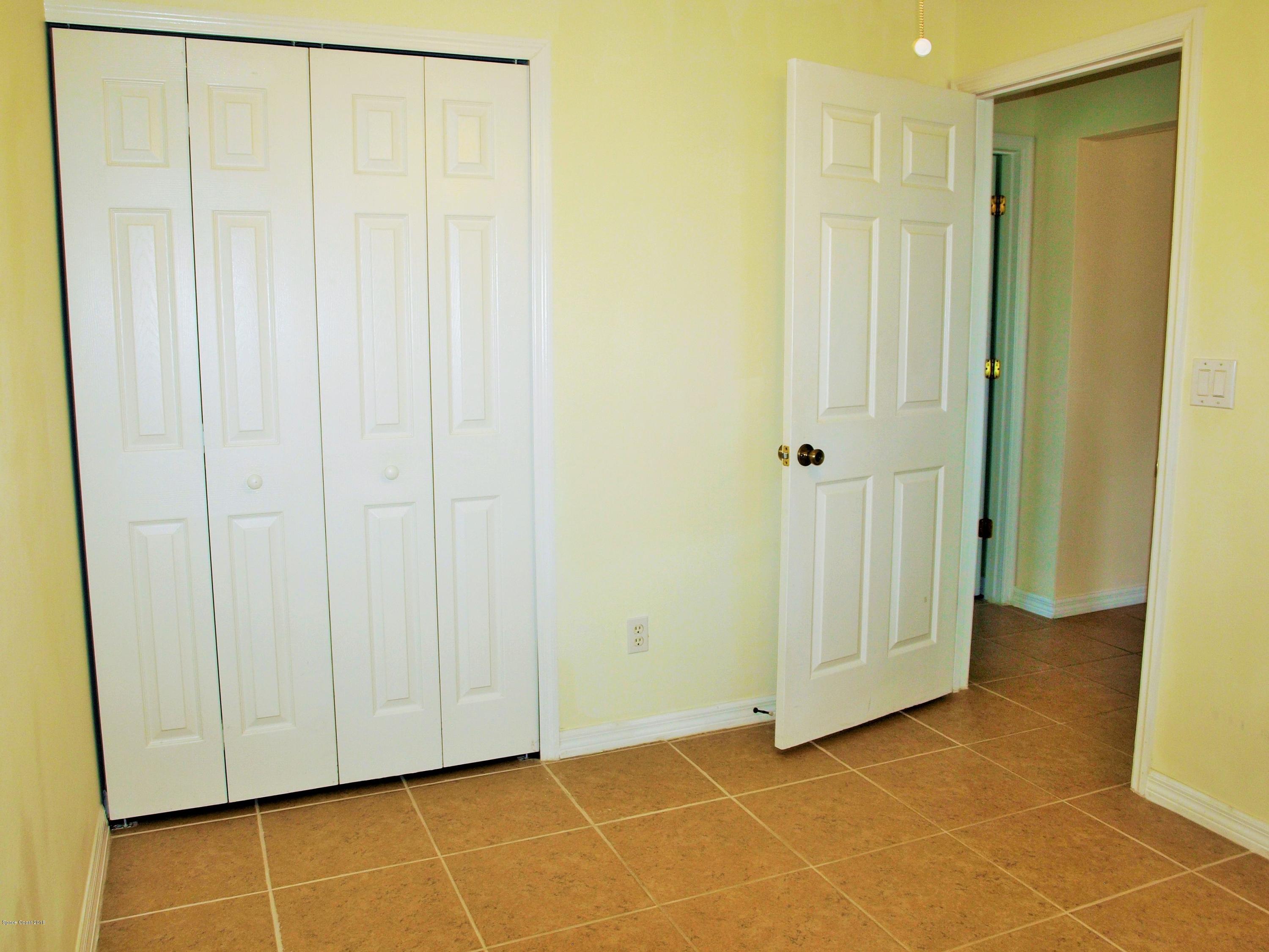 247 Crystal Lake Road Melbourne, FL 32901 - Photo 12 of 22 a view of a room with sliding door