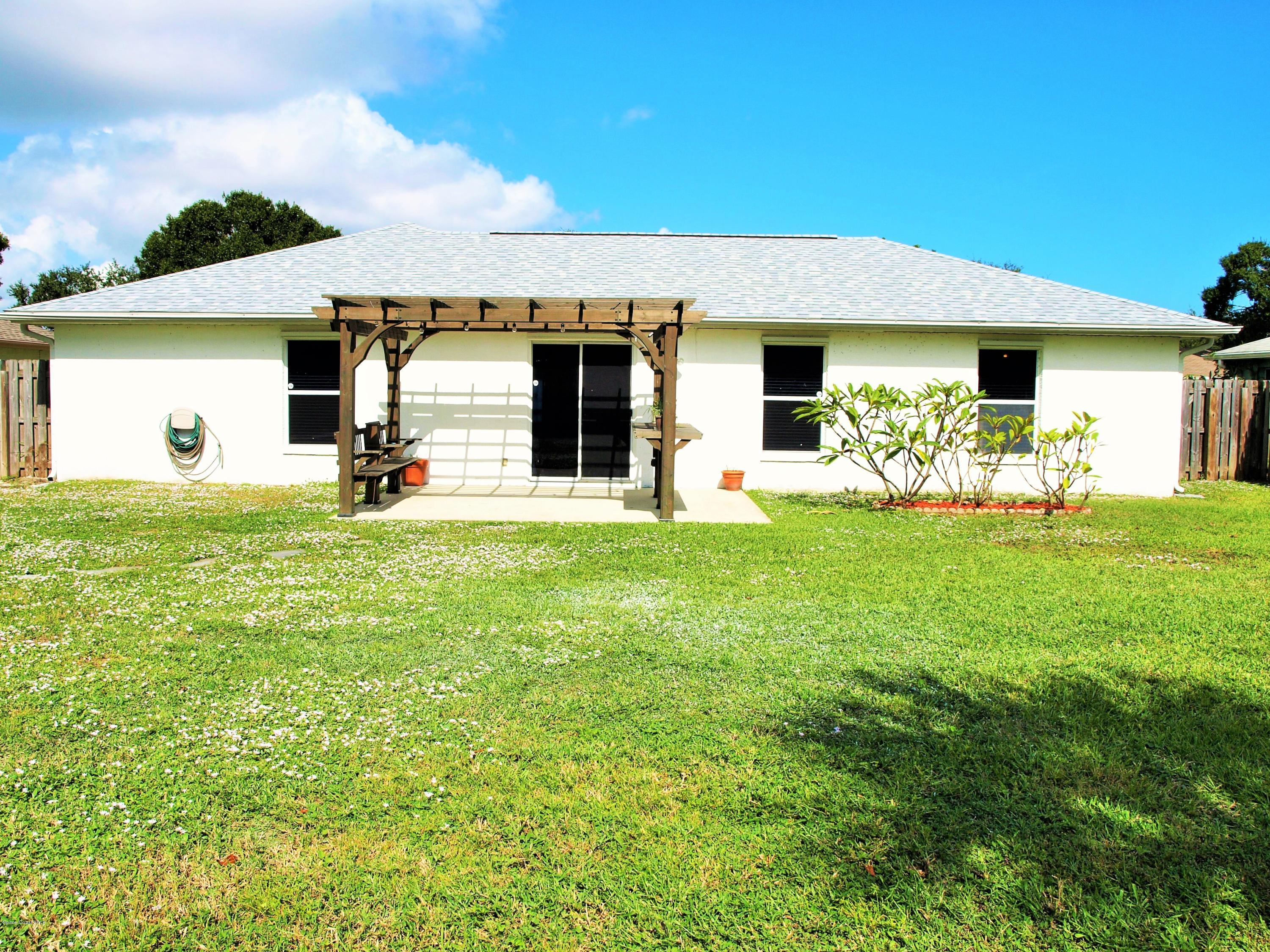 247 Crystal Lake Road Melbourne, FL 32901 - Photo 16 of 22 a view of a house with yard and porch
