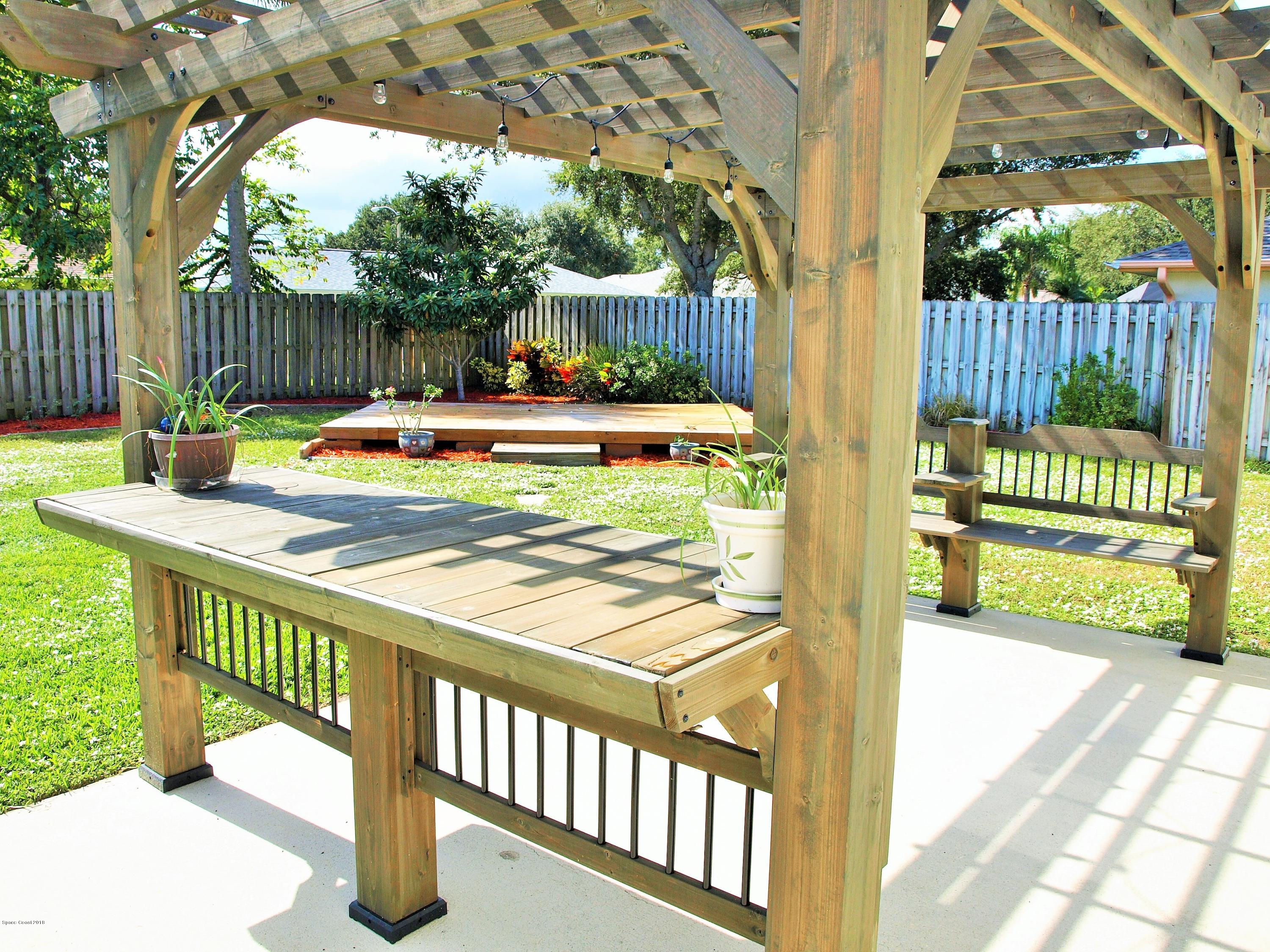 247 Crystal Lake Road Melbourne, FL 32901 - Photo 20 of 22 a view of swimming pool with a patio and a yard