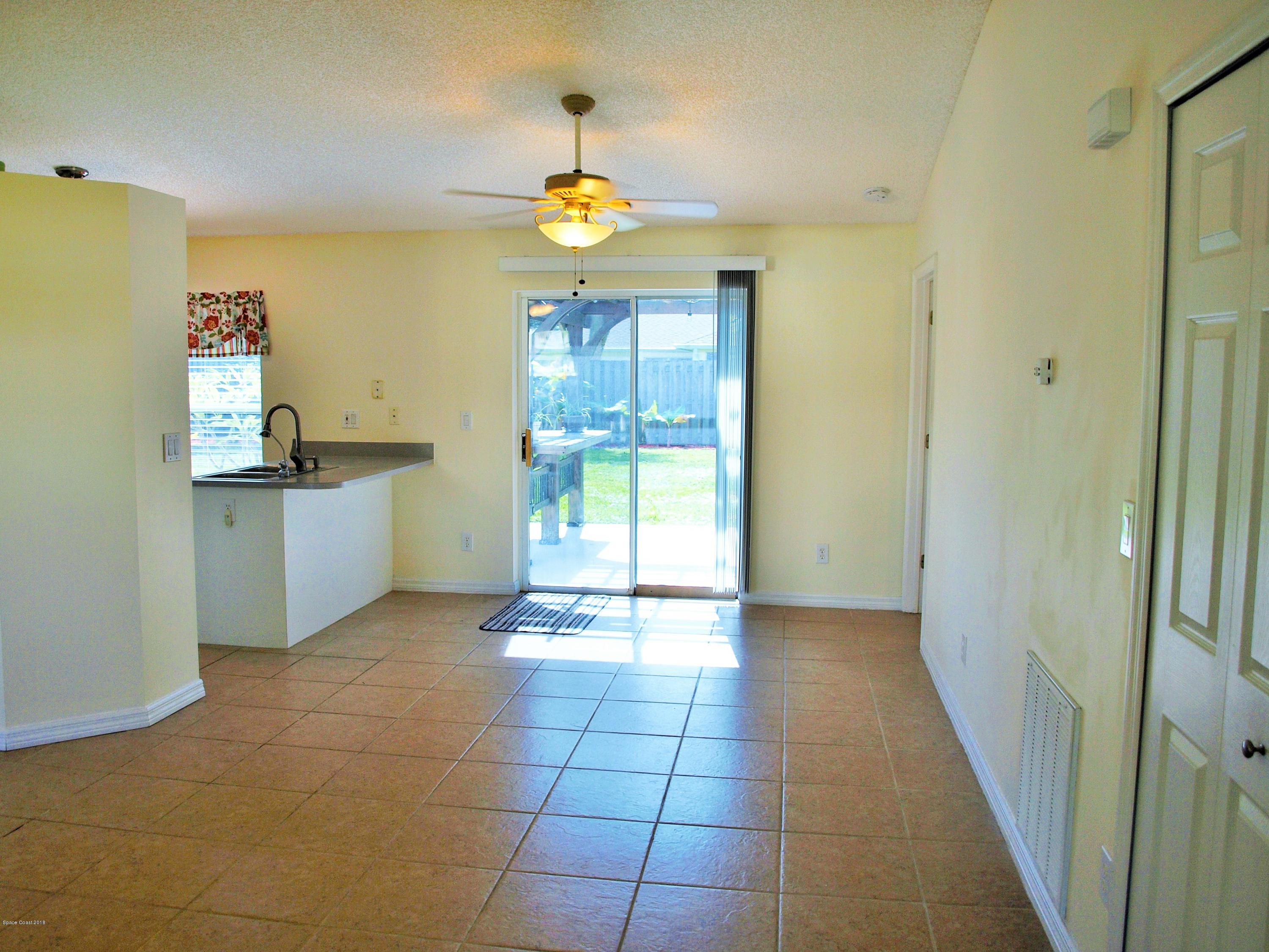 247 Crystal Lake Road Melbourne, FL 32901 - Photo 3 of 22 a view of a storage & utility room with a window