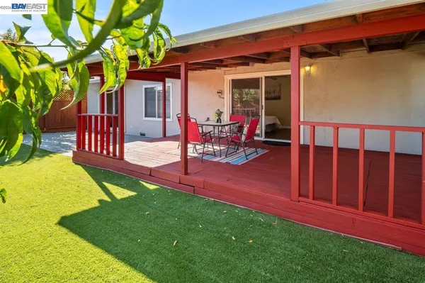 a view of a backyard with sitting area