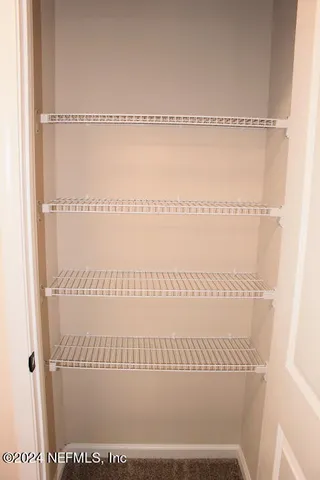 a view of a bathroom with a glass door