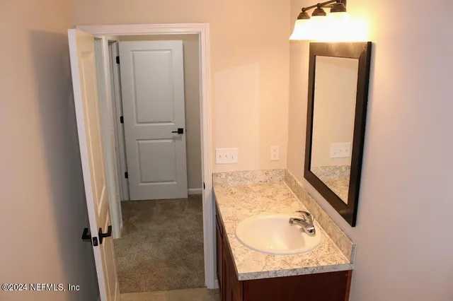 a bathroom with a tub and a sink