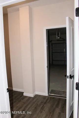 a view of an empty room with windows