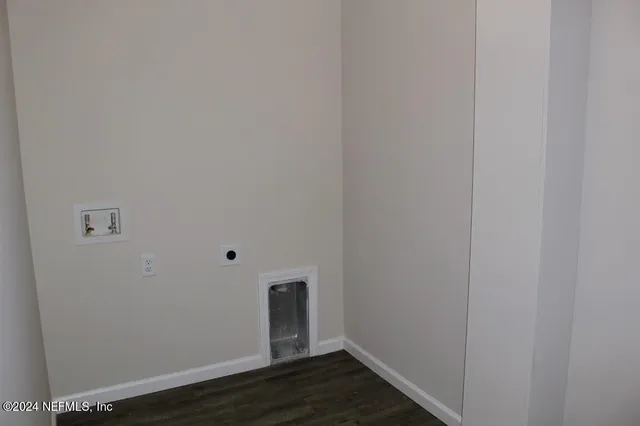 a front view of a house with a yard and tree s