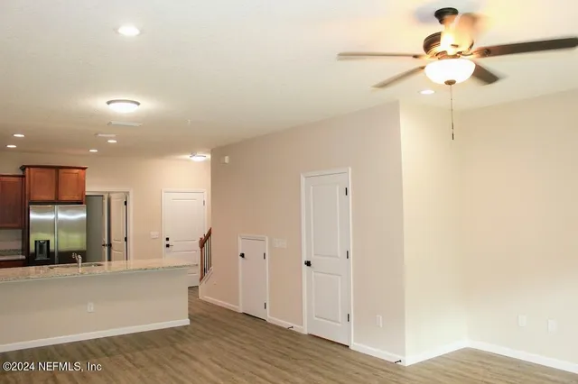 a view of a hallway with a chandelier