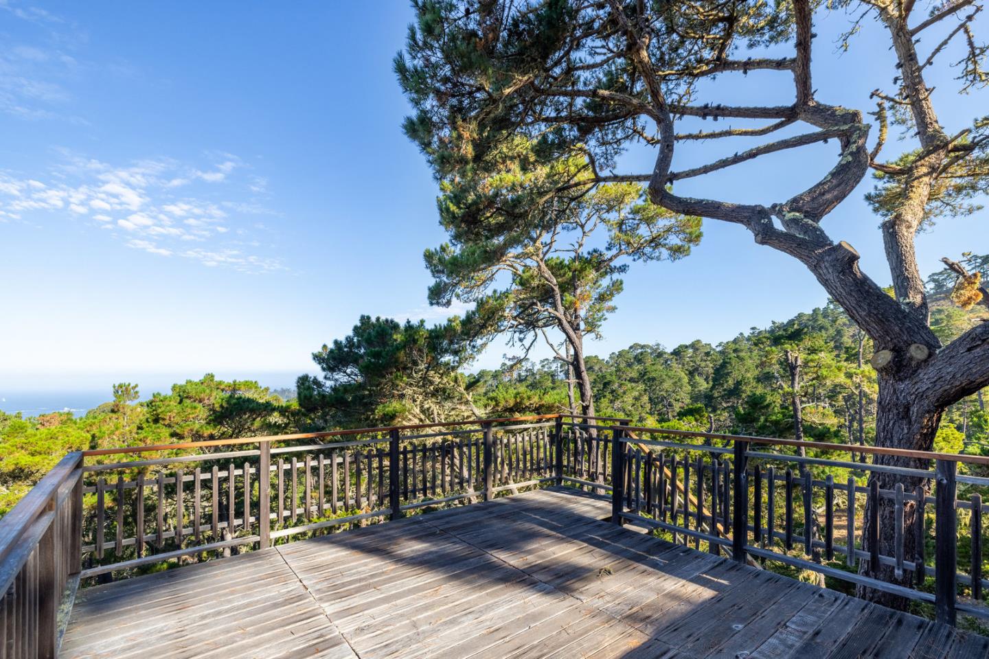 73 Mt Devon Road Carmel Highlands, CA 93923 - Photo 40 of 88 a view of a balcony with wooden floor and fence