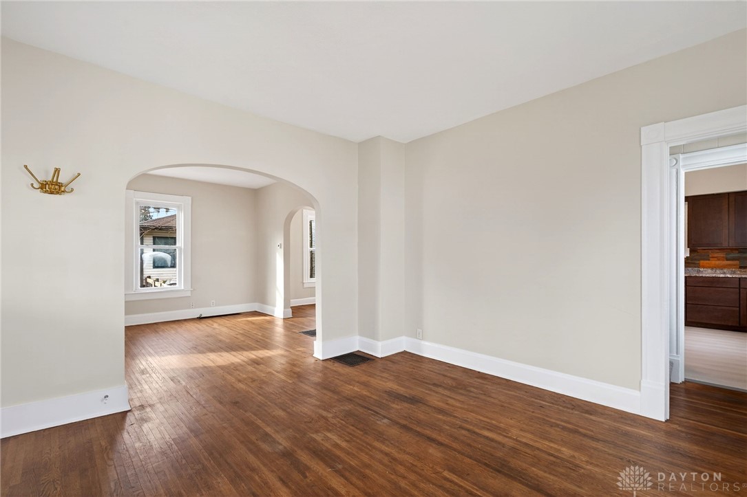 585 North Spring Street Wilmington, OH 45177 - Photo 4 of 21 Bright and open interior with rich hardwood flooring and charming architectural arches.