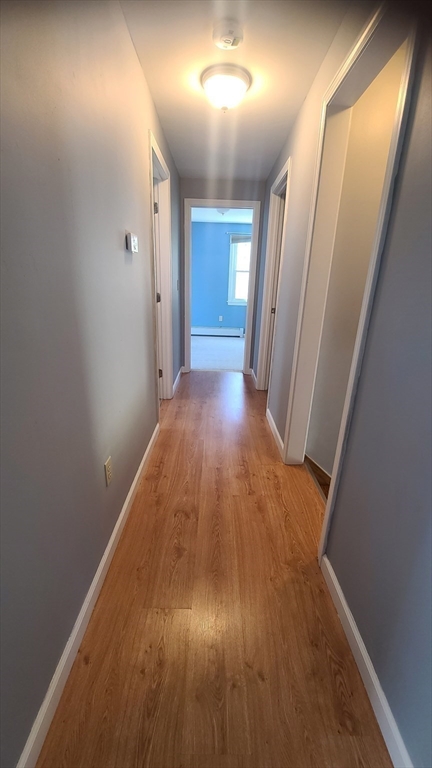 56 Cote Road Monson, MA 01057 - Photo 11 of 20 wooden floor in an empty room with a mirror