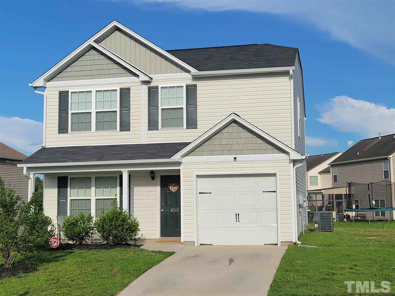 6343 Slopeside Court Raleigh, NC 27610 - Photo 1 of 14 a view of a house with garden