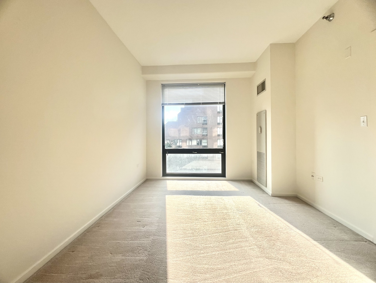 1 East 8th Street, Unit 307 Chicago, IL 60605 - Photo 12 of 23 a view of an empty room with a window