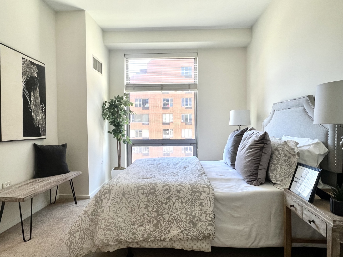 1 East 8th Street, Unit 307 Chicago, IL 60605 - Photo 14 of 24 a bedroom with a bed and a couch