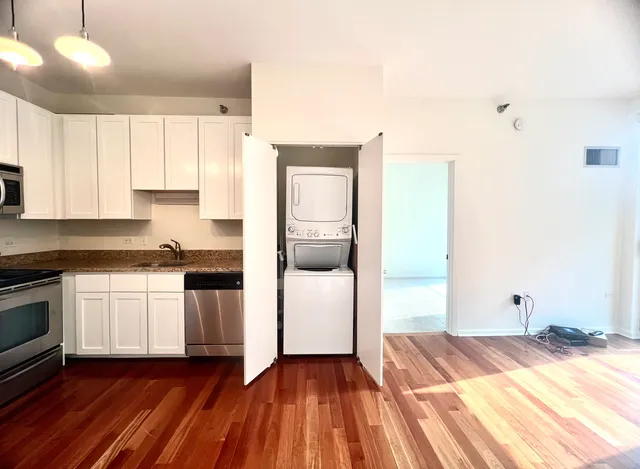 a kitchen with a sink and a stove top oven